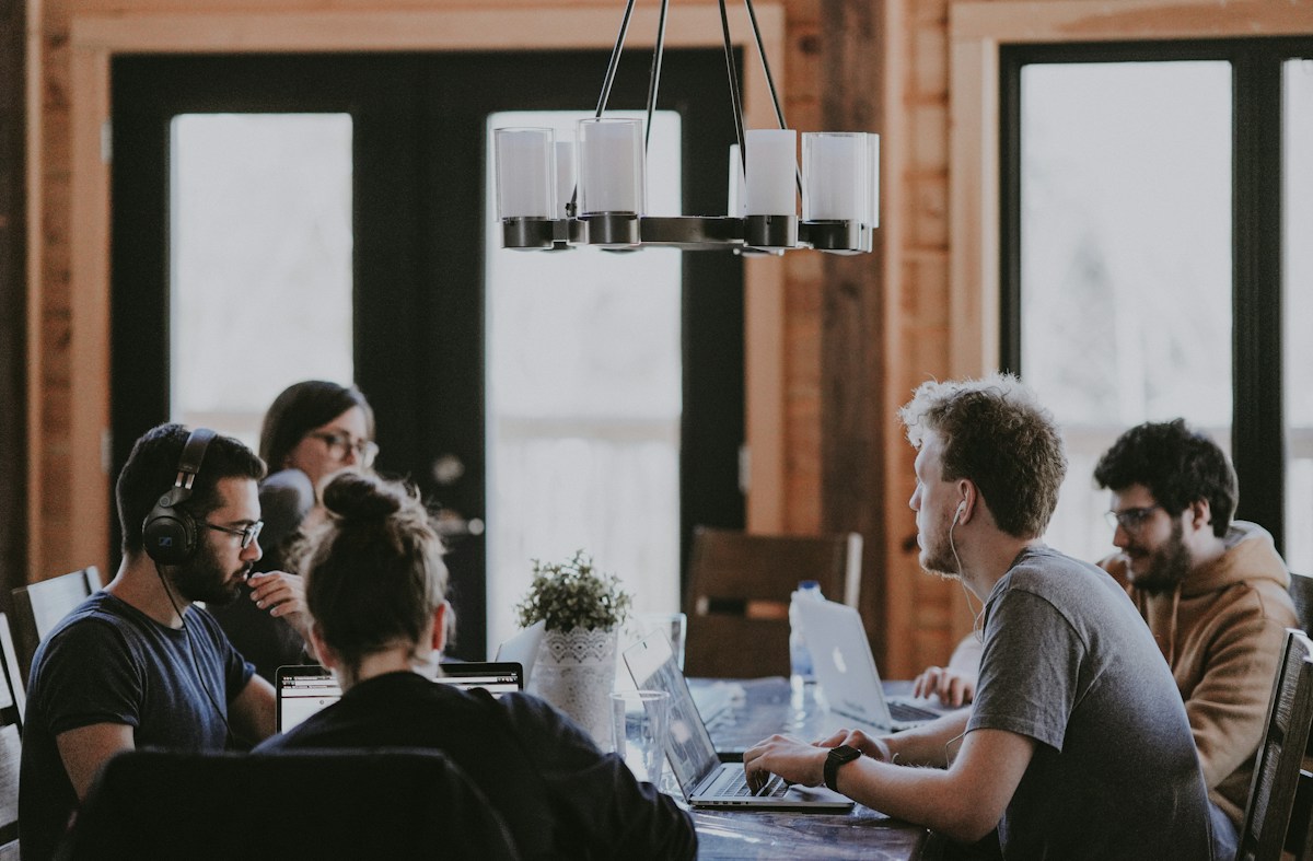 A small group exchanging ideas around a table