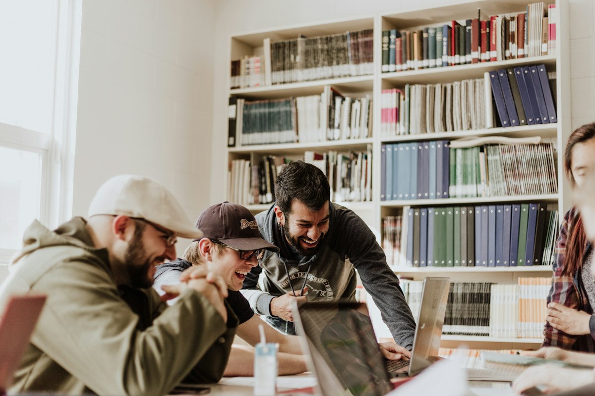 Young adults collaborating in a library