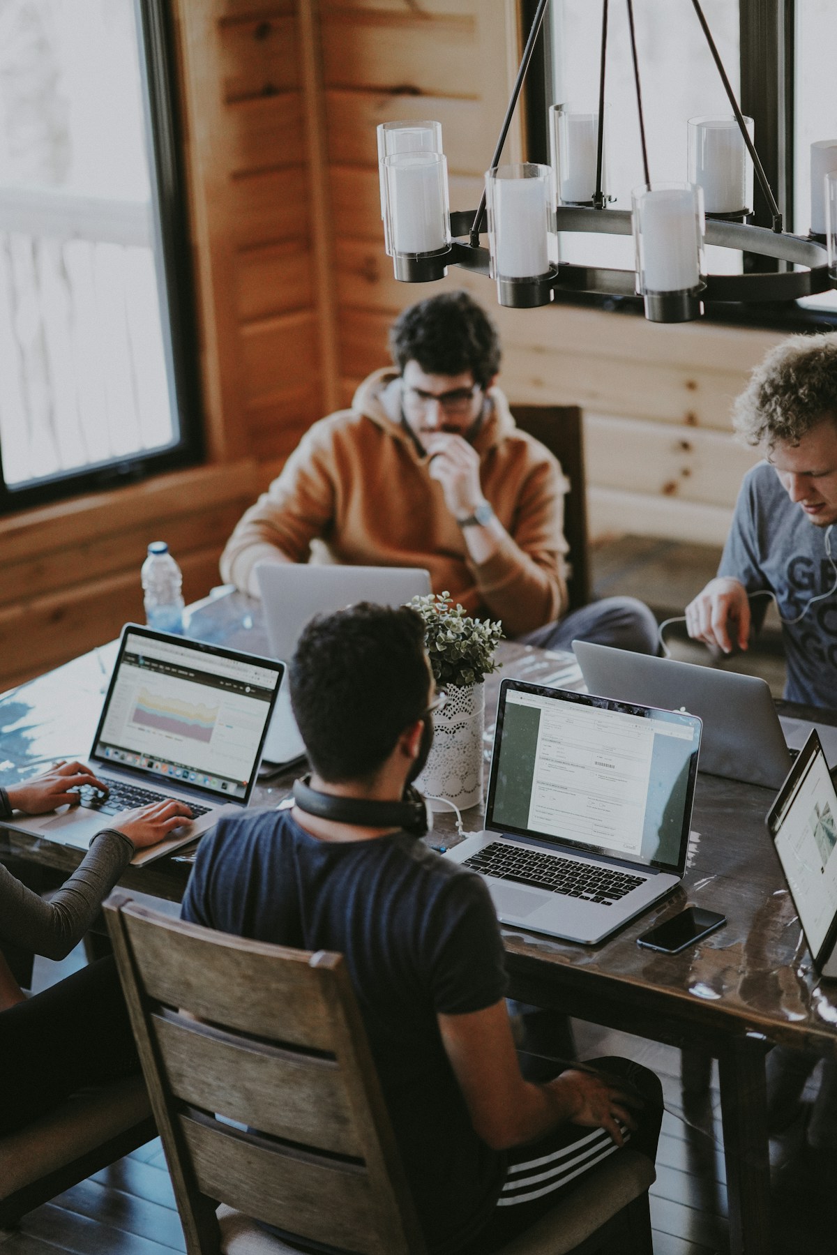 A team reviewing work together at a table